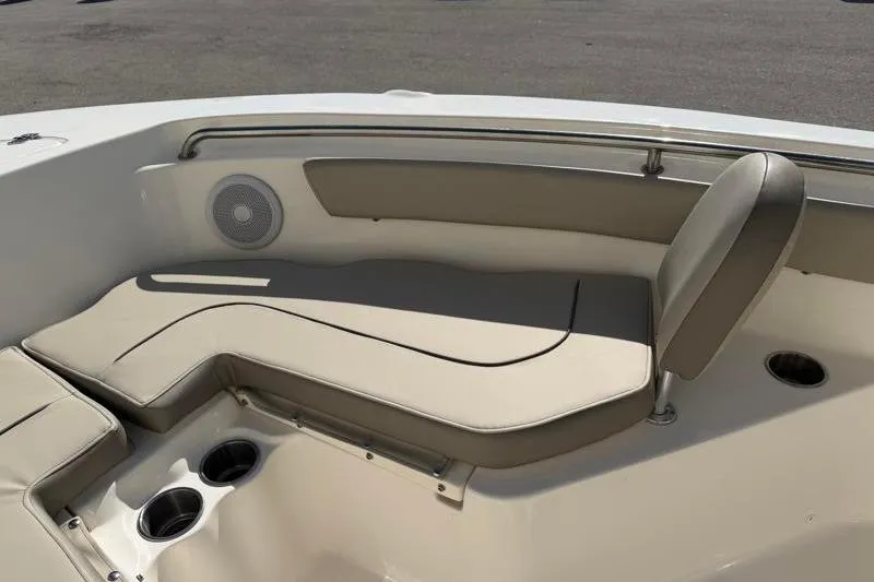Slide: The Image of 2023 Key West 203 FS boat interior with beige seating and cup holders. - 17