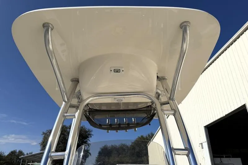 Slide: The Image of 2023 Key West 203 FS boat T-top structure under clear blue sky. - 21