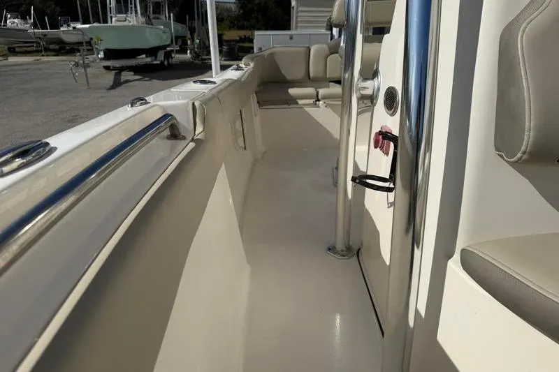 Slide: The Image of 2023 Key West 203 FS boat interior with seating and stainless steel railings. - 22