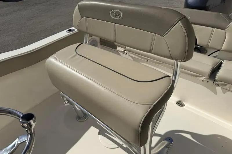 Slide: The Image of 2023 Key West 203 FS boat seat with beige upholstery and chrome accents. - 24