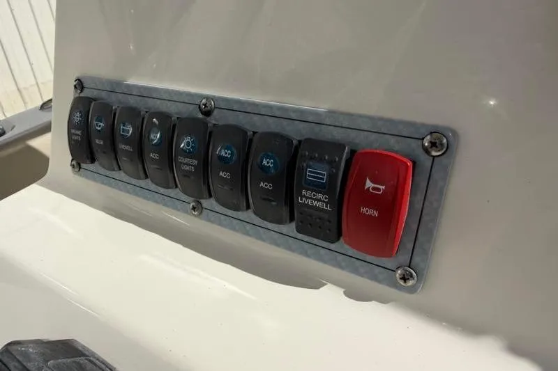 Slide: The Image of Control panel on 2023 Key West 203 FS boat with labeled switches. - 28