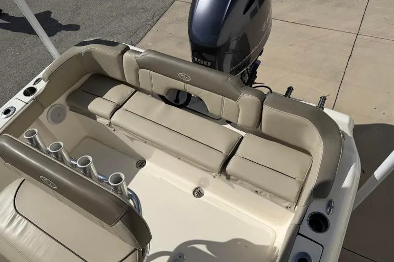 Slide: The Image of 2023 Key West 203 FS boat interior with seating and motor, showcasing luxury design. - 32