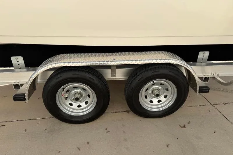 Slide: The Image of 2023 Key West 203 FS trailer with dual wheels on concrete surface. - 43