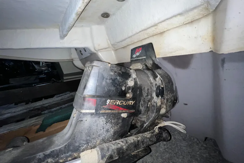 Slide: The Image of 2003 Sea Ray 225 Weekender boat engine, featuring a Mercury outdrive. - 20