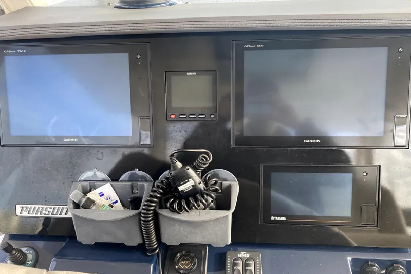 Slide: The Image of Control panel of 2018 Pursuit S 328 Sport boat with Garmin displays and accessories. - 6