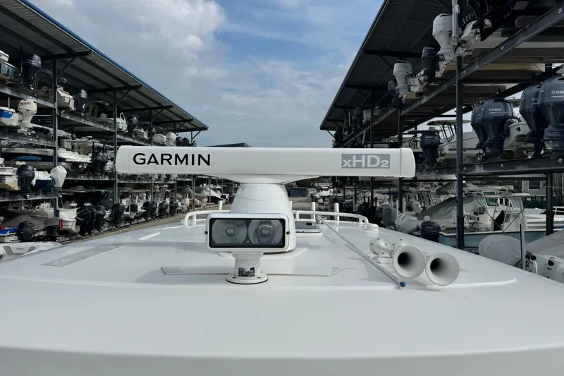 Slide: The Image of 2018 Pursuit S 328 Sport boat with Garmin xHD2 radar in a marina storage. - 9