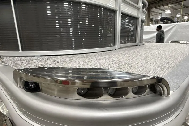 Slide: The Image of 2026 Bennington 22SXSR pontoon boat with sleek design and modern lighting. - 6