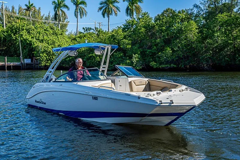 Slide: The Image of 2019 NauticStar 243DC Sport Deck boat cruising on a sunny day. - 24