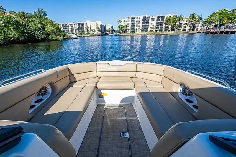 Slide: The Image of 2019 NauticStar 243DC Sport Deck boat interior with waterfront view. - 9