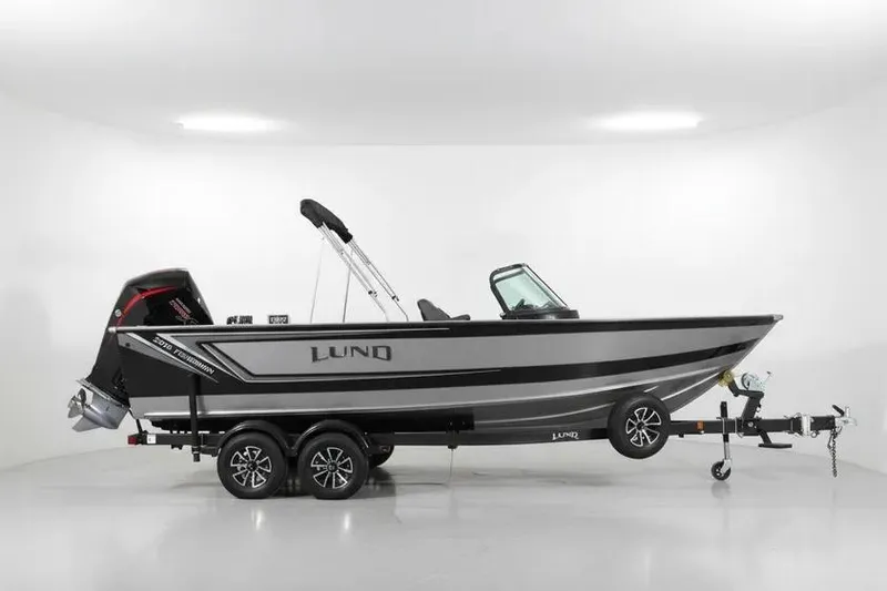The Image of 2026 Lund 2075 Fisherman boat on trailer in a white studio setting. - 0