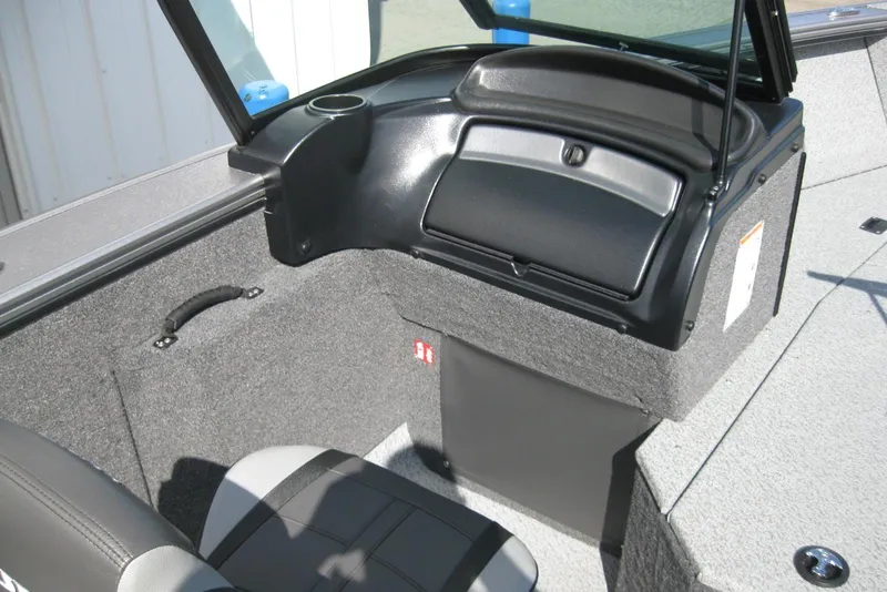 Slide: The Image of 2026 Lund 2075 Fisherman boat interior with seating and storage compartment. - 14