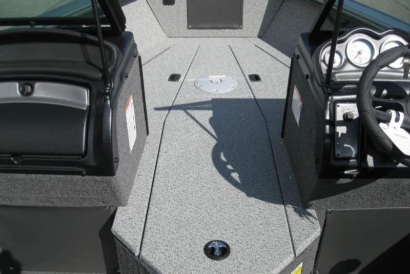 Slide: The Image of Interior view of 2026 Lund 2075 Fisherman boat, featuring dashboard and steering wheel. - 16