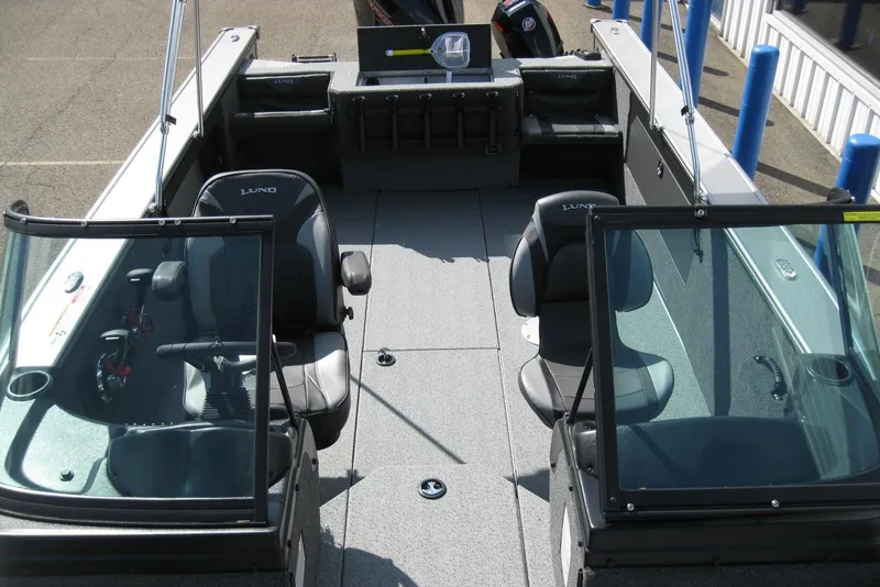 Slide: The Image of 2026 Lund 2075 Fisherman boat interior with seating and windshield. - 19