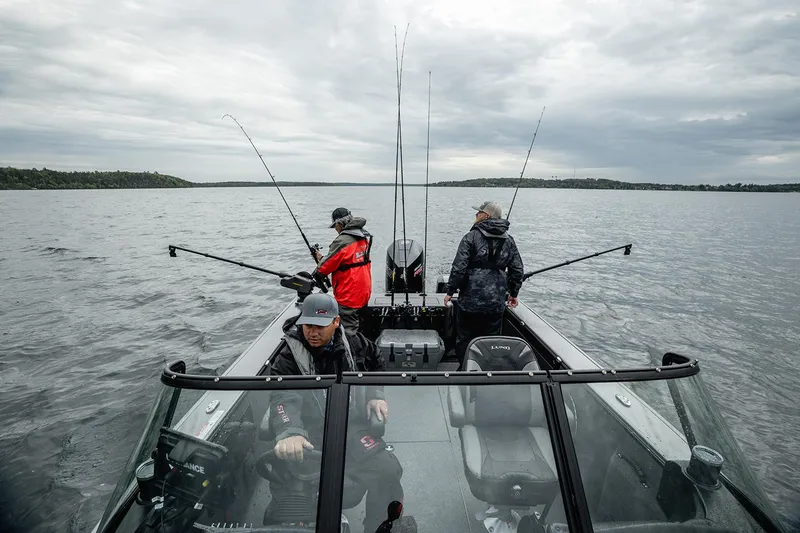 Slide: The Image of Manufacturer Provided Image: Three people fishing on a 2025 Lund 2075 Fisherman boat in a lake. - 21