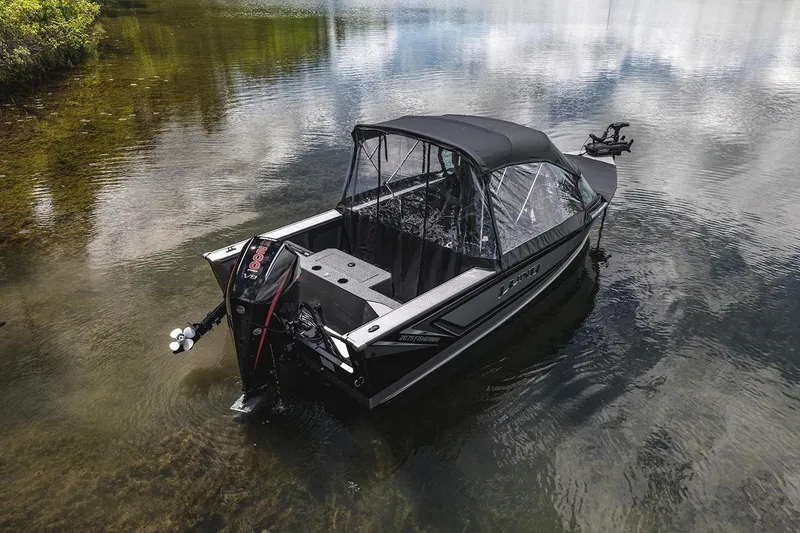Slide: The Image of Manufacturer Provided Image: 2025 Lund 2075 Fisherman boat on calm lake water. - 25