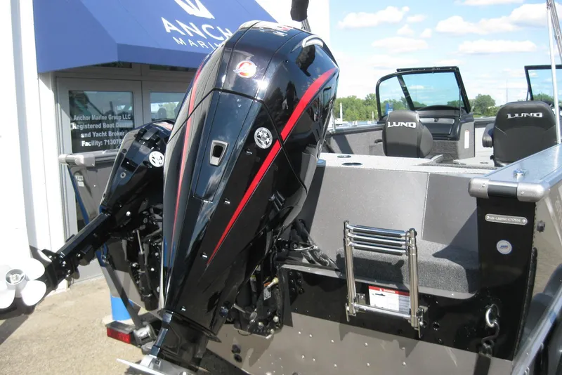 Slide: The Image of 2026 Lund 2075 Fisherman boat with powerful outboard motor at Anchor Marine. - 5