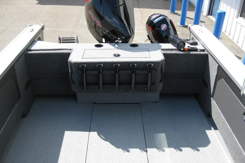 Slide: The Image of 2026 Lund 2075 Fisherman boat interior with rod holders and motor. - 8