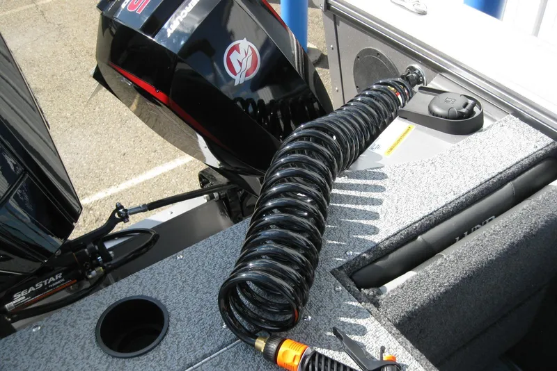 Slide: The Image of 2026 Lund 2075 Fisherman boat with coiled hose and outboard motor. - 9