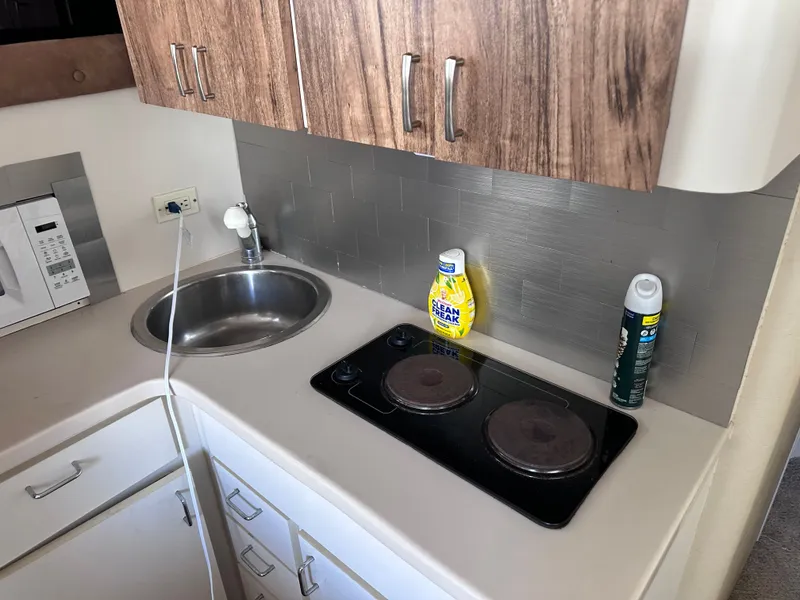 Slide: The Image of 1995 Mainship 40 Sport Sedan with wood deck at dock. - 15