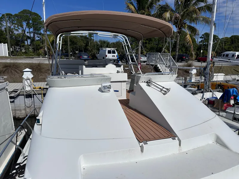 Slide: The Image of 1995 Mainship 40 Sport Sedan at dock, sunny day. - 2