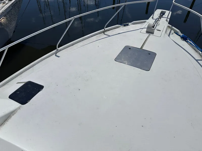 Slide: The Image of Bow of a 1995 Mainship 40 Sport Sedan with anchor chain. - 5