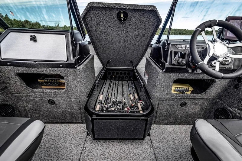 Slide: The Image of Manufacturer Provided Image: 2025 Lund 1875 Impact XS Sport boat interior with rod storage compartment open. - 15