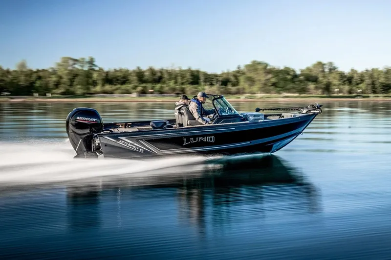 Slide: The Image of Manufacturer Provided Image: 2025 Lund 1875 Impact XS Sport boat speeding on a calm lake. - 21