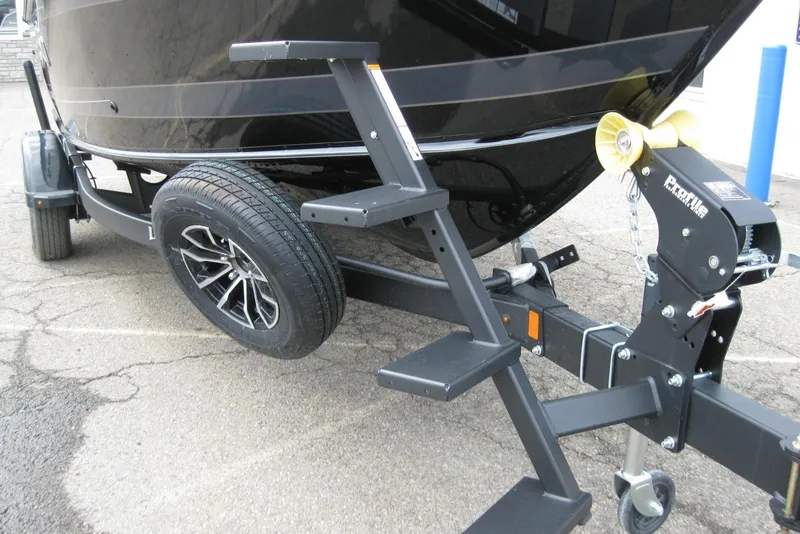 Slide: The Image of 2025 Lund 1875 Impact XS Sport boat on trailer with steps and winch. - 3