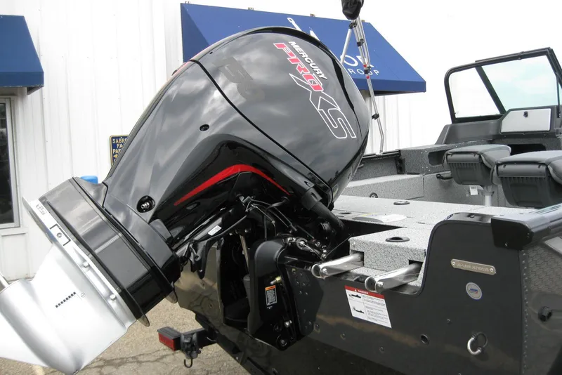 Slide: The Image of 2025 Lund 1875 Impact XS Sport boat with powerful Mercury outboard motor. - 6