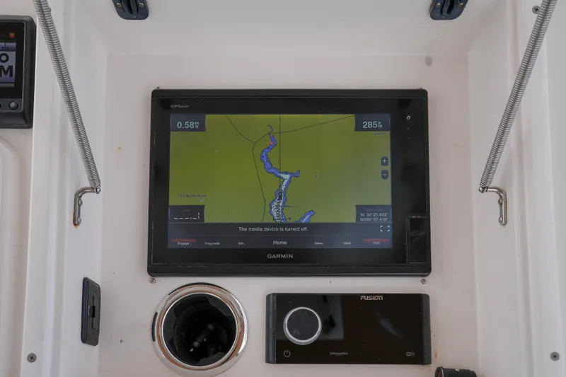 Slide: The Image of Garmin GPS display on 1999 Intrepid 366 boat dashboard, showing navigation map. - 19