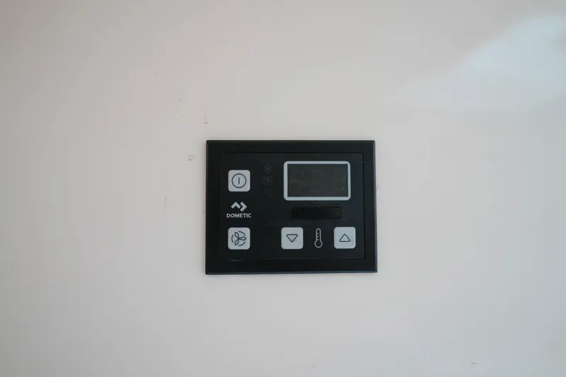 Slide: The Image of Control panel on a 1999 Intrepid 366 boat, featuring Dometic system. - 28