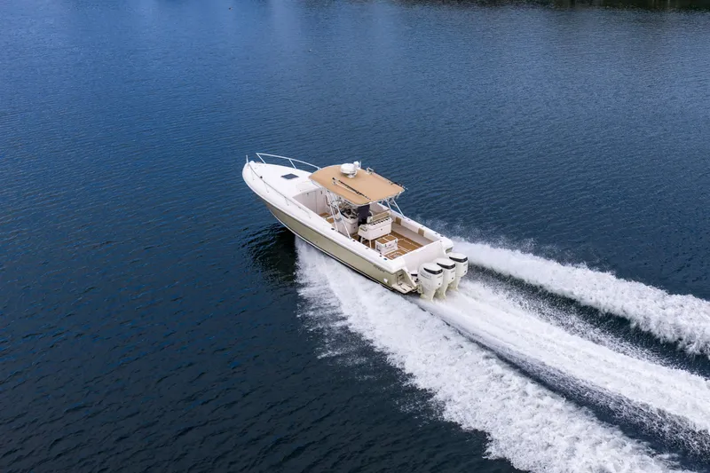 Slide: The Image of 1999 Intrepid 366 boat cruising on open water with powerful engines. - 37