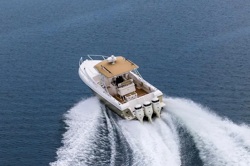 Slide: The Image of Aerial view of 1999 Intrepid 366 boat cruising on open water. - 42
