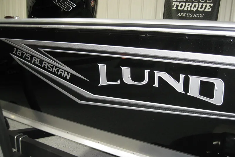 Slide: The Image of Lund 1800 Alaskan SS 2025 boat with sleek black and silver design. - 3