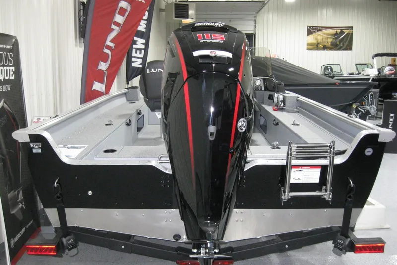 Slide: The Image of 2025 Lund 1800 Alaskan SS boat with Mercury 115 engine in showroom. - 5