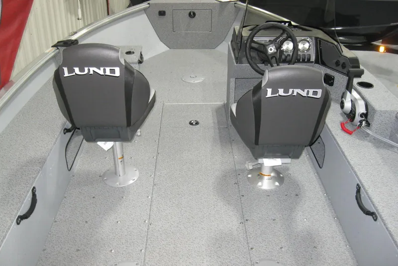 Slide: The Image of 2025 Lund 1800 Alaskan SS boat interior with dual seats and steering console. - 8