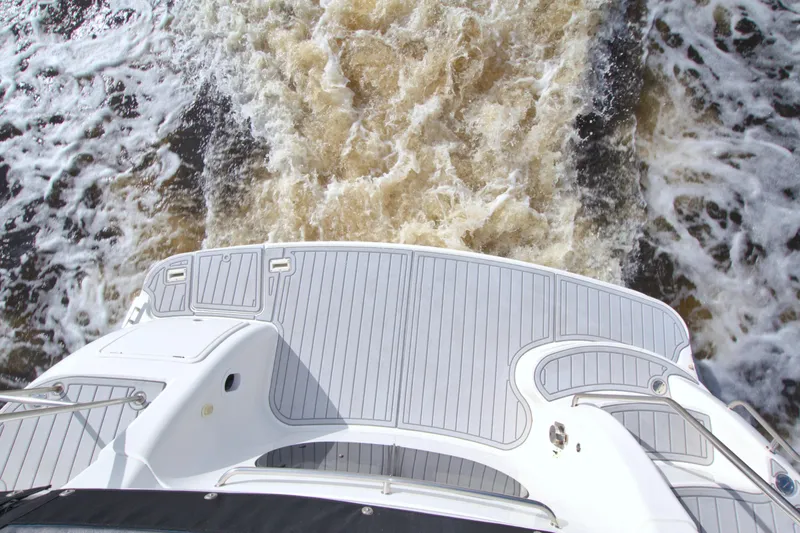 Slide: The Image of 2006 Silverton 39 Motor Yacht cruising, view from deck, water wake visible. - 13