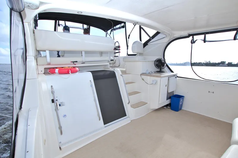 Slide: The Image of 2006 Silverton 39 Motor Yacht interior with seating, steps, and water view. - 15
