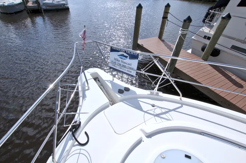 Slide: The Image of 2006 Silverton 39 Motor Yacht docked at marina with water view. - 29