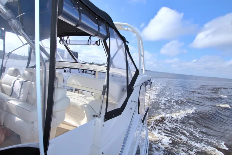 Slide: The Image of 2006 Silverton 39 Motor Yacht cruising on open water under a clear blue sky. - 33