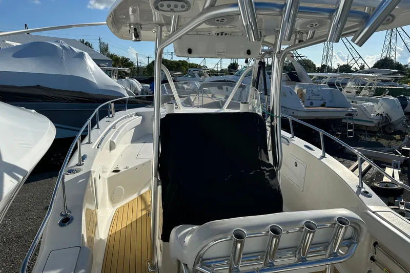 Slide: The Image of 2014 Tidewater 250 CC Adventure boat with sleek design and spacious deck. - 12