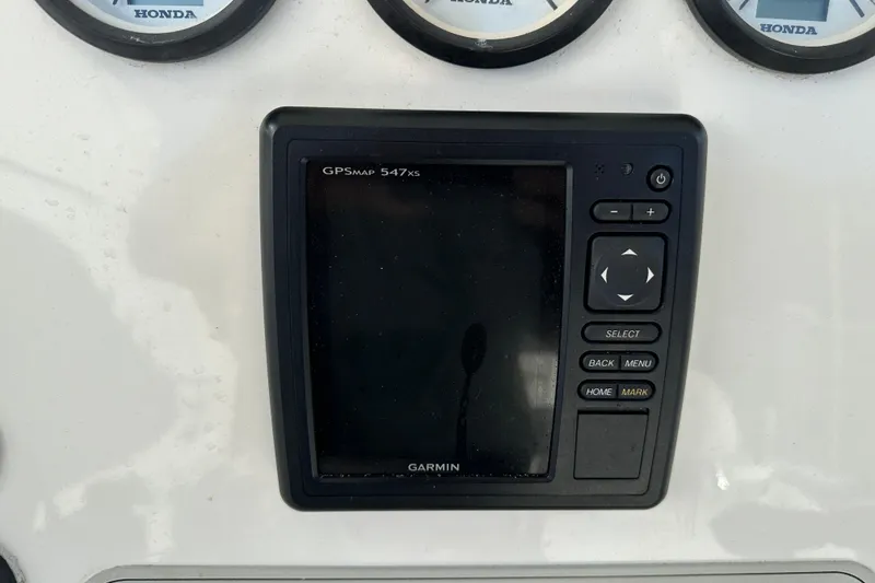 Slide: The Image of Garmin GPSmap 547xs on 2014 Tidewater 250 CC Adventure boat dashboard. - 16