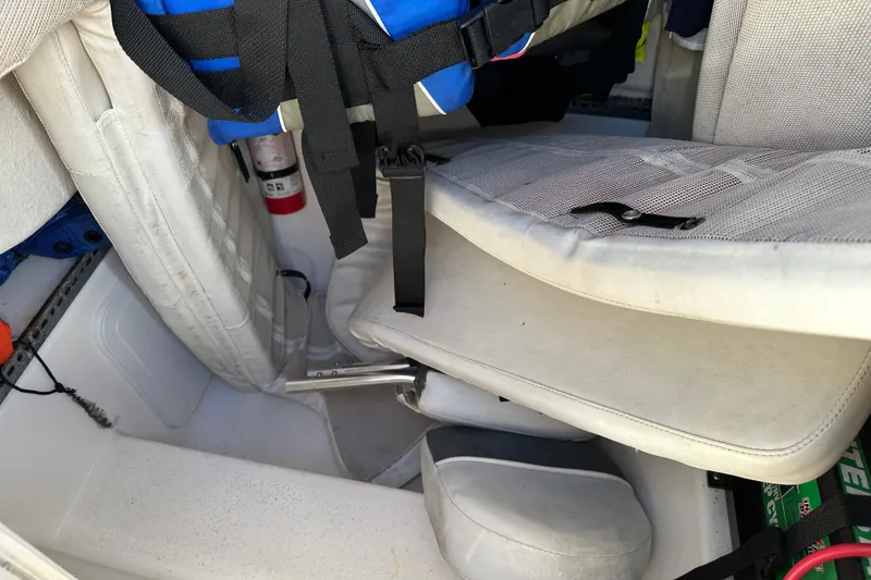 Slide: The Image of 2014 Tidewater 250 CC Adventure boat interior with seating and safety equipment. - 21