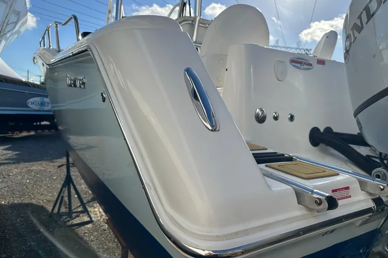 Slide: The Image of 2014 Tidewater 250 CC Adventure boat, close-up view of stern and engine area. - 29