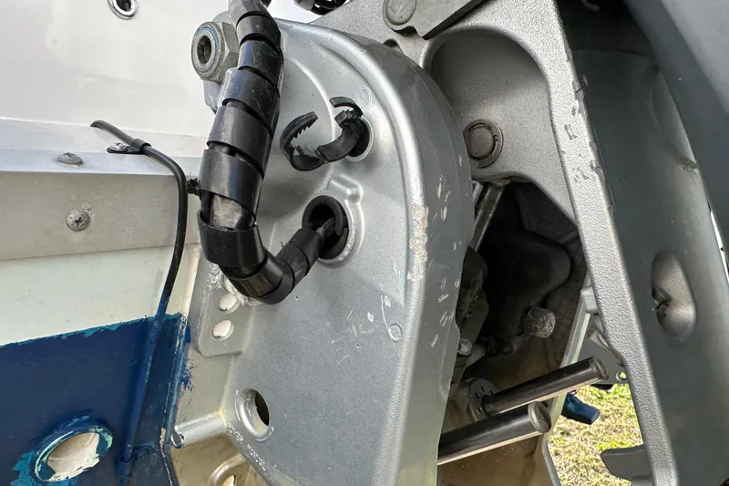 Slide: The Image of Close-up of 2014 Tidewater 250 CC Adventure boat engine mount and wiring. - 30