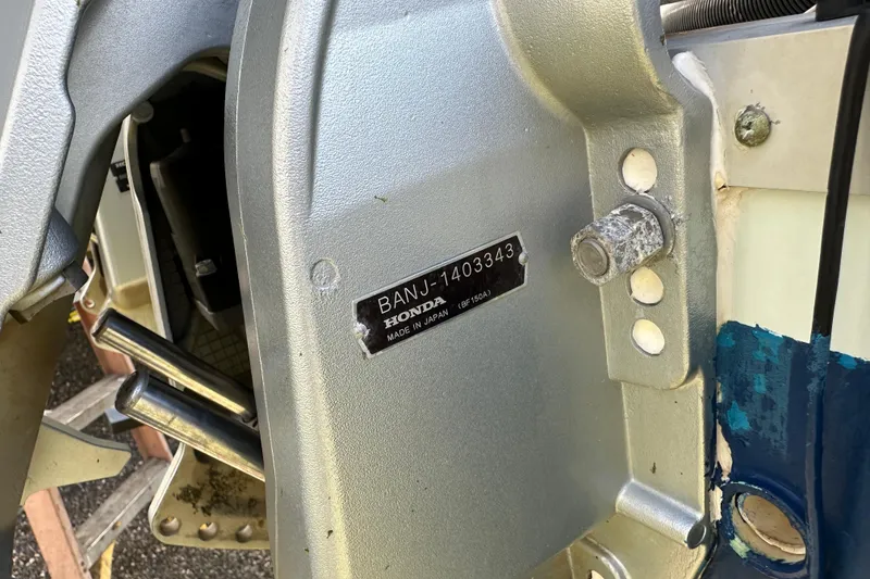 Slide: The Image of Close-up of a Honda engine part on a 2014 Tidewater 250 CC Adventure boat. - 4