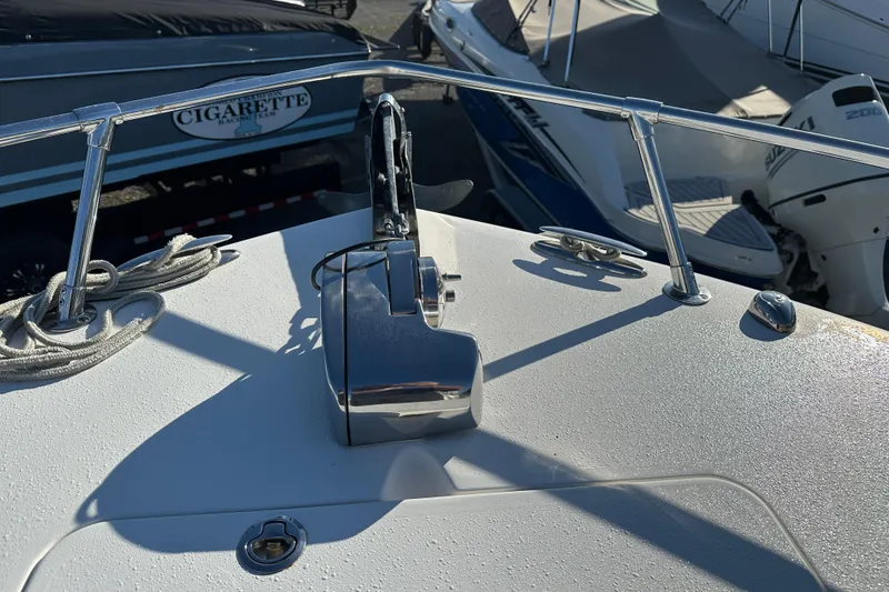 Slide: The Image of 2014 Tidewater 250 CC Adventure boat deck with anchor and railing. - 8