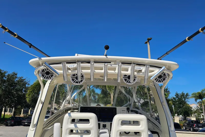 Slide: The Image of 2008 Hydra-Sports Vector 3500 VX boat with fishing rods and speakers under clear blue sky. - 16