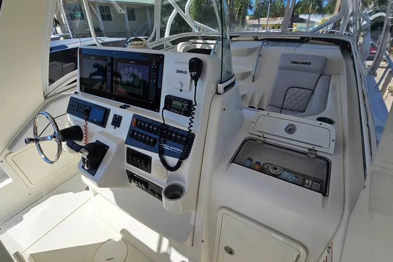 Slide: The Image of 2008 Hydra-Sports Vector 3500 VX boat cockpit with advanced navigation controls. - 19