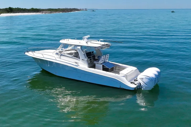 Slide: The Image of 2008 Hydra-Sports Vector 3500 VX boat on calm ocean waters. - 2